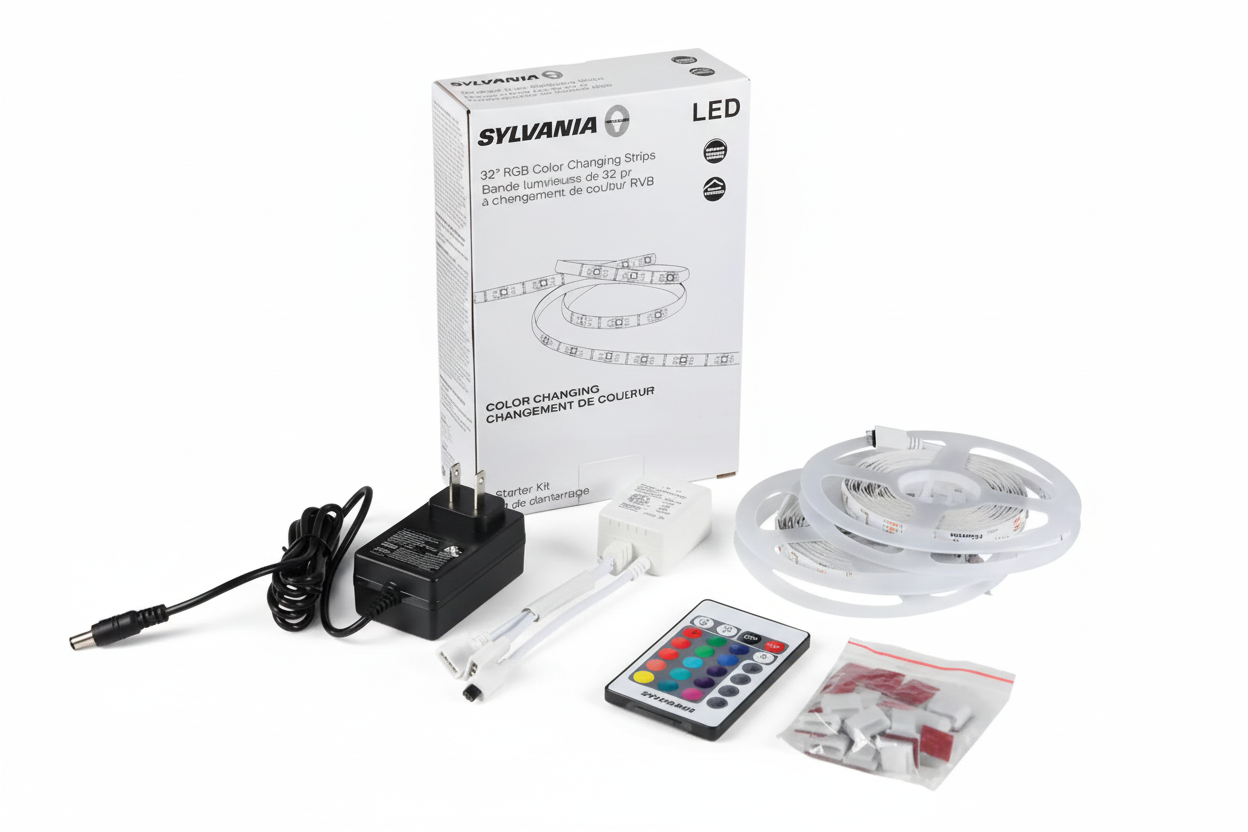 Sylvania LED color-changing strip kit with packaging, power adapter, remote control, and accessories on a white background.