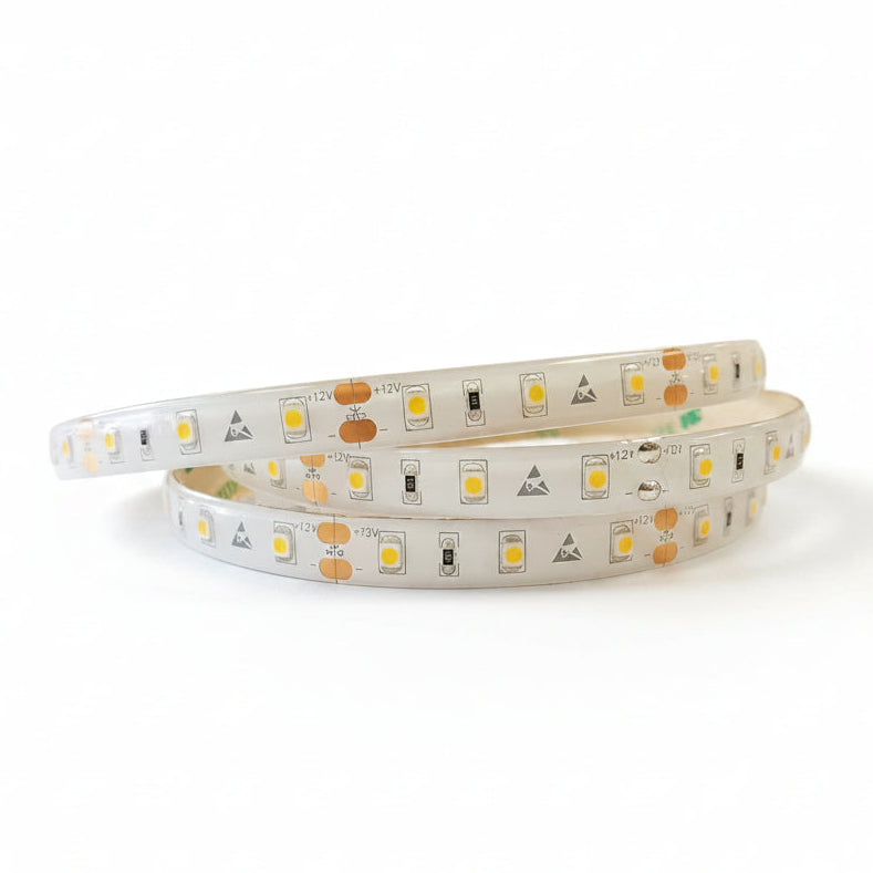 A spool of white FlexStrip-CV LED strip lights with individual LED units visible.